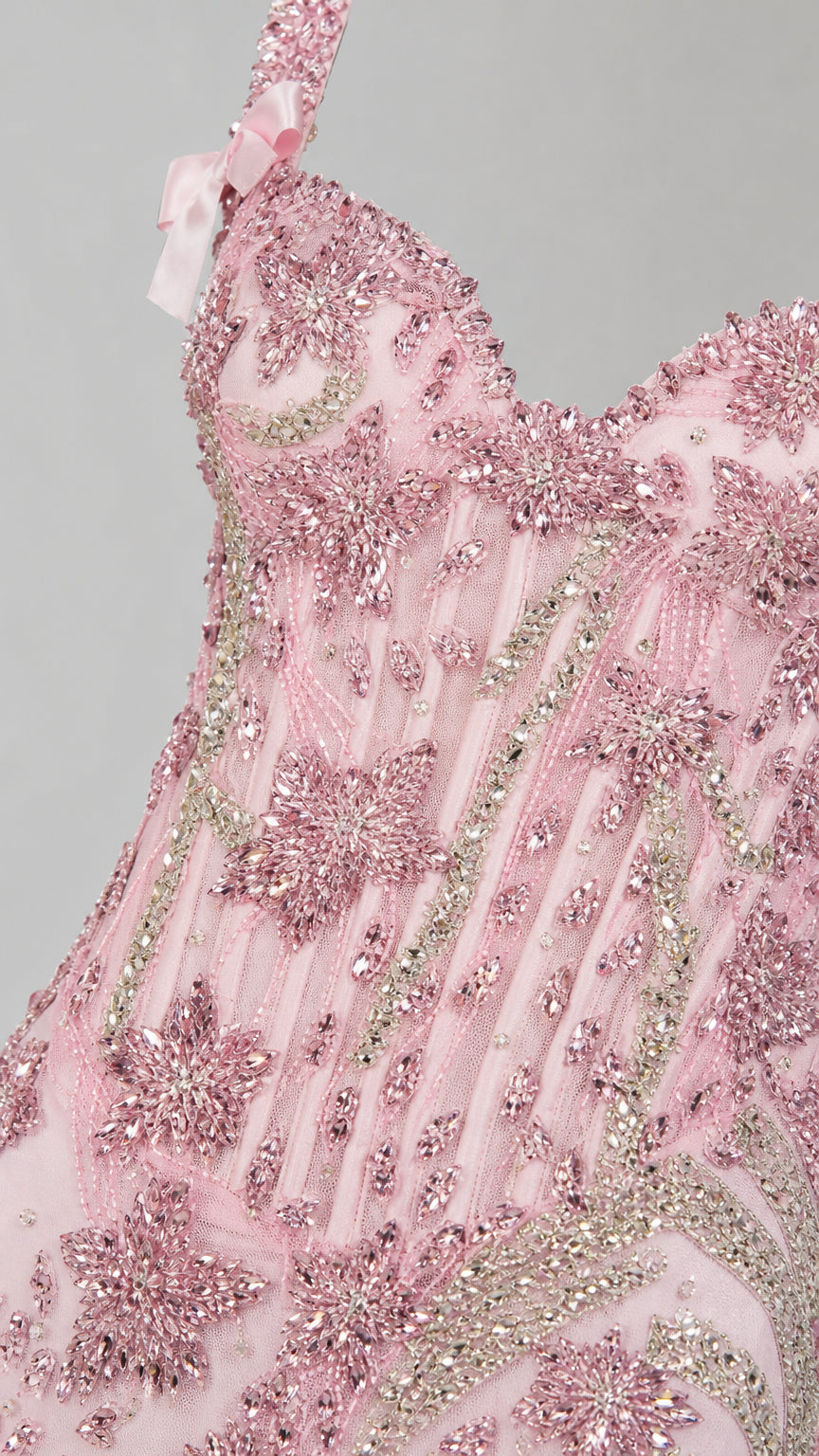 Close-up detail of bodice sequin floral embroidery and bow strap