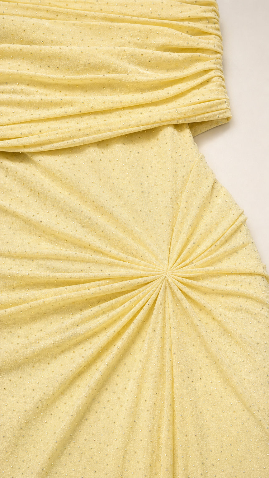 Close-up detail of textured shimmer fabric and sunburst waist gathering