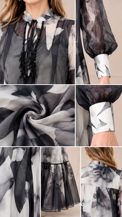 Close-up details of tie neckline, tassel trim, cuff, and tiered hem