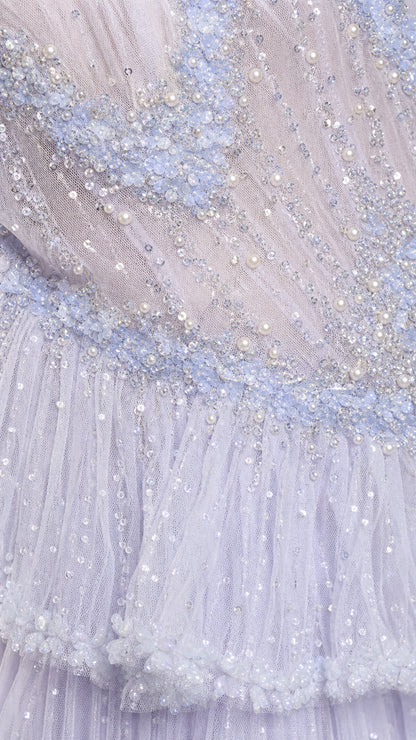 Close-up of intricate pearl and bead embellishments on tulle fabric