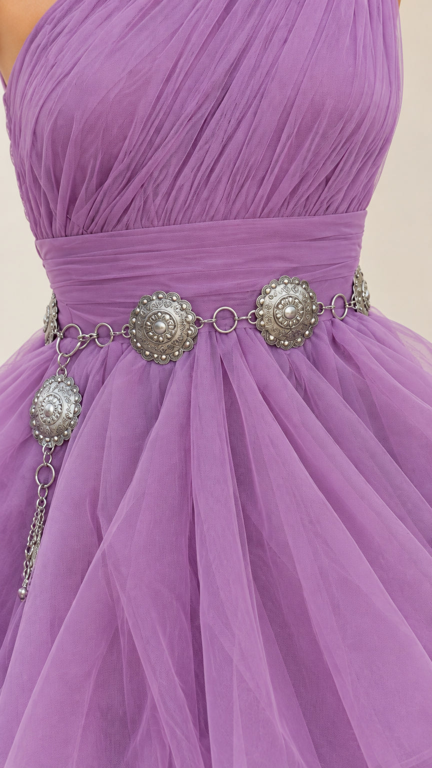 Close-up of ruched bodice and tiered tulle detailing on lavender gown