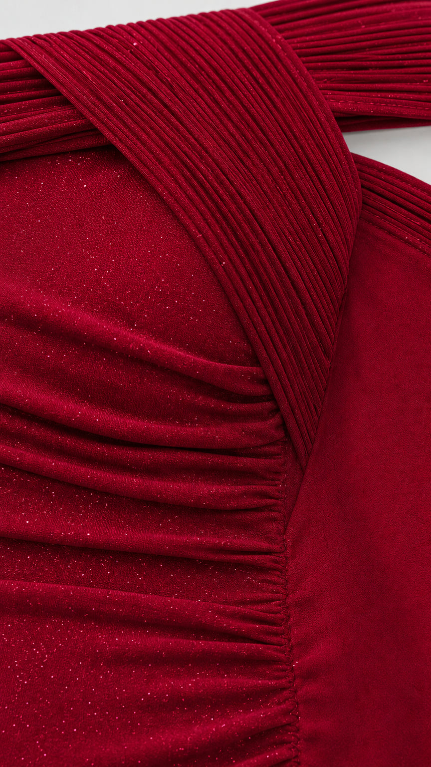 Close-up of pleated crossover neckline and shimmer textured fabric