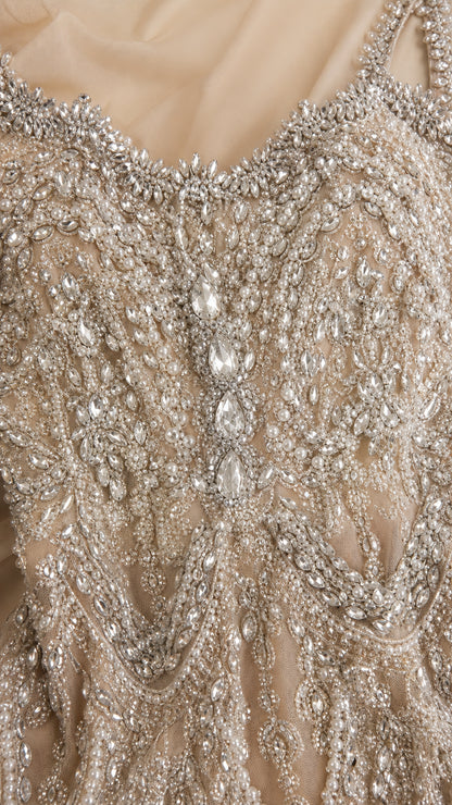 Close-up detail of silver rhinestone and crystal beadwork on mesh overlay