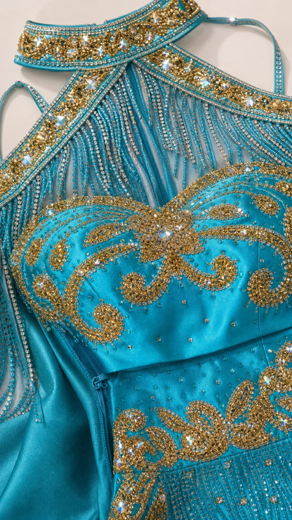 Close-up detail of aqua blue halter neckline with gold beadwork and beaded fringe