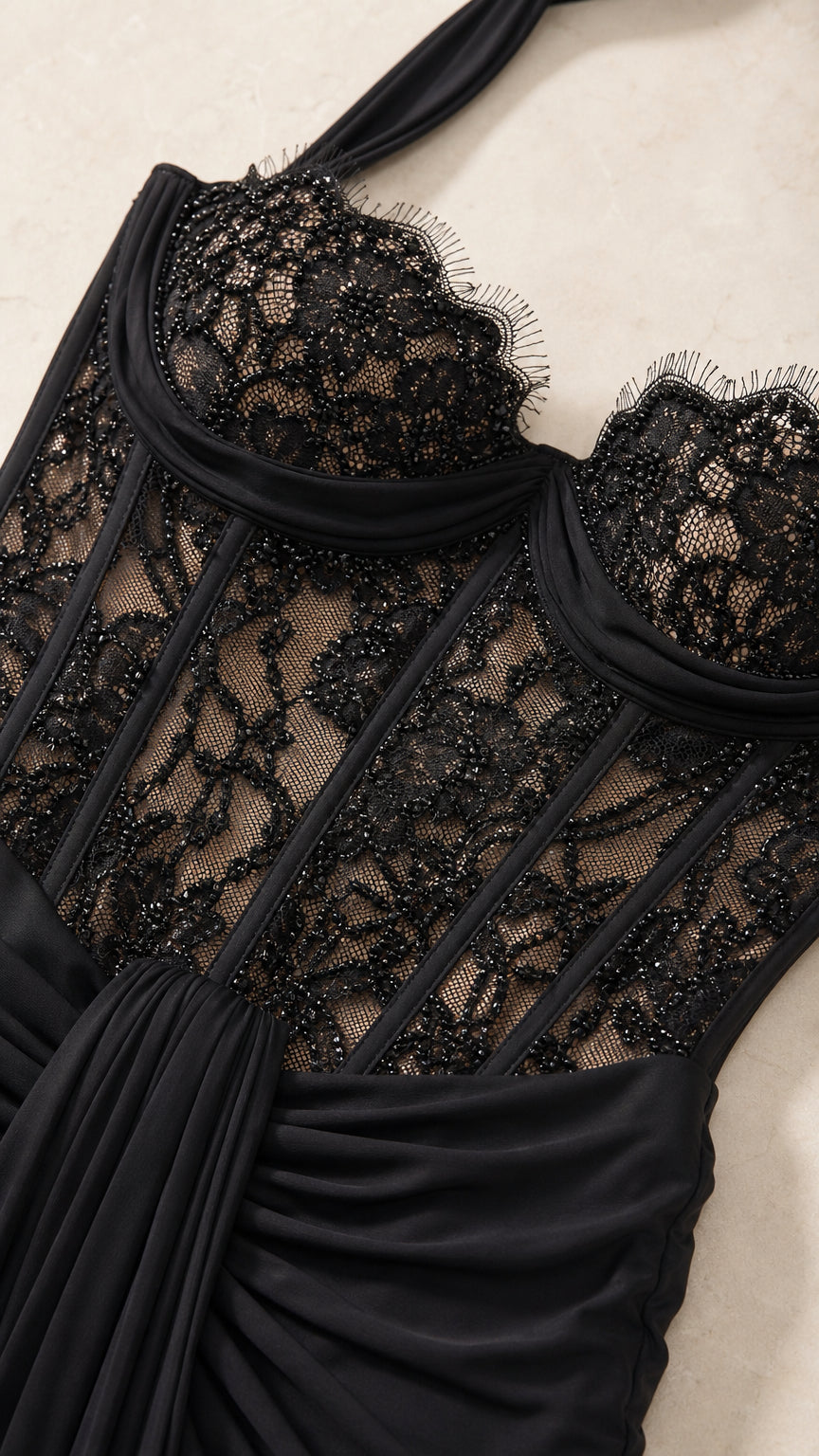 Close-up detail of sheer floral lace corset bodice with boning
