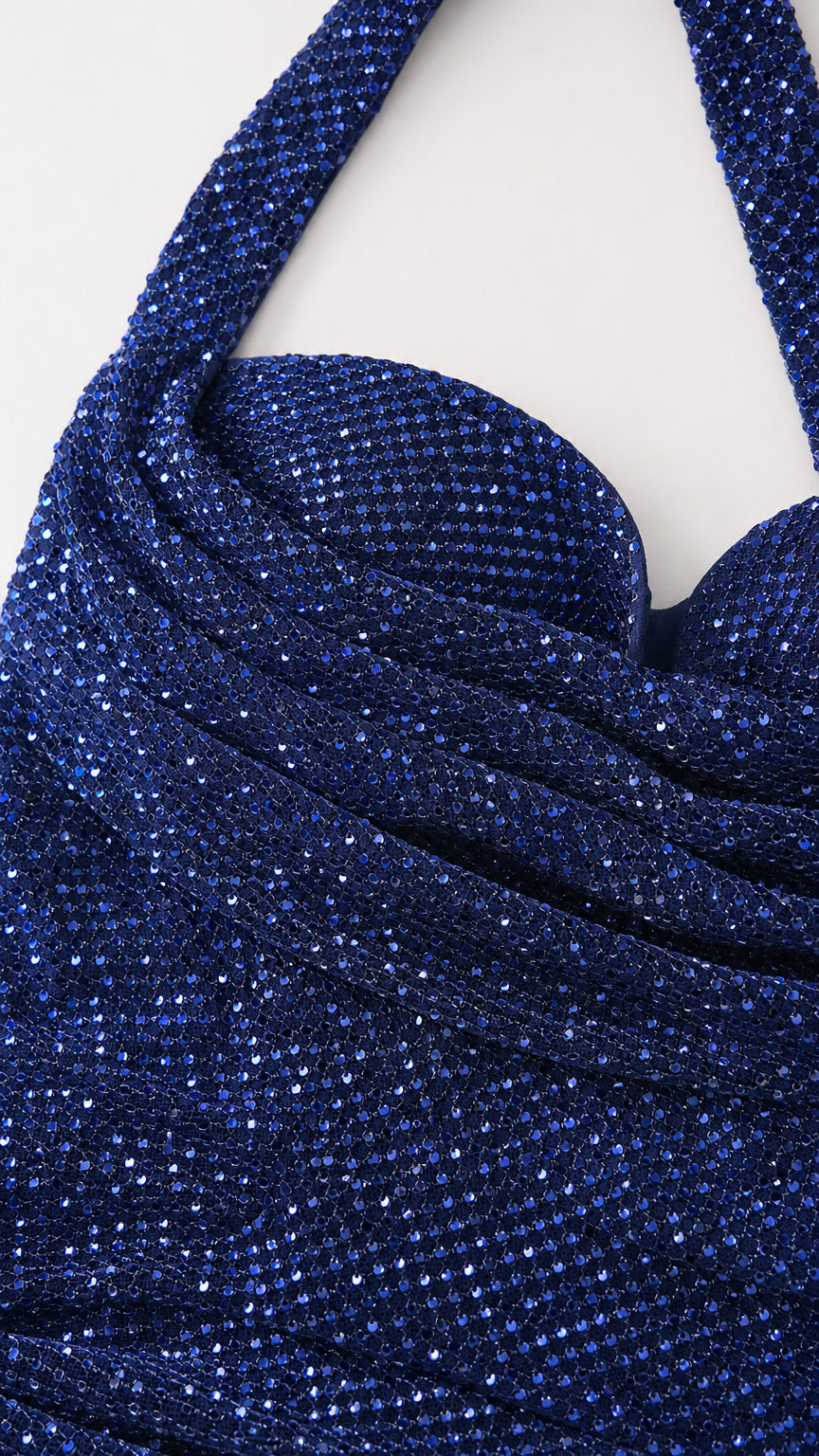 Close up of textured Navy Blue glitter fabric and ruched neckline