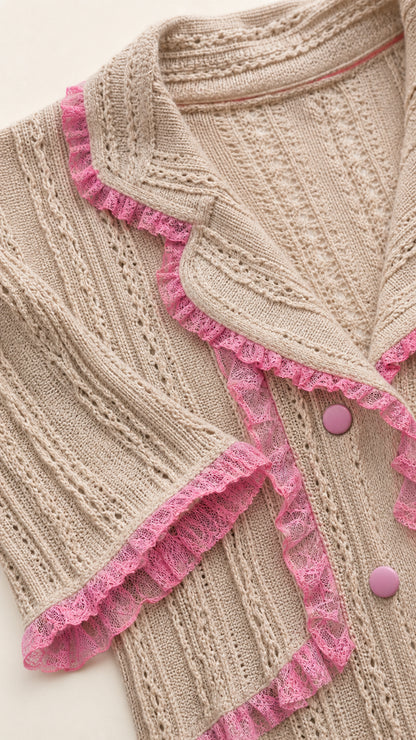 Close-up of beige knit fabric texture, notch collar, and pink lace trim
