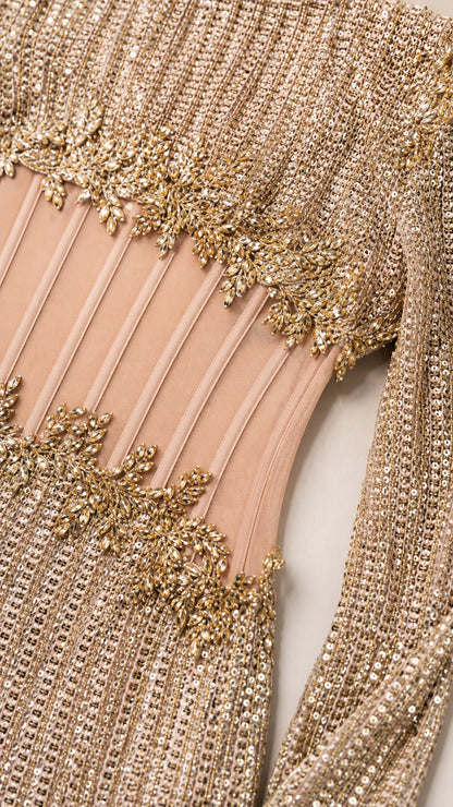Close-up detail of sheer illusion corset waist with metallic floral embroidery and sequins