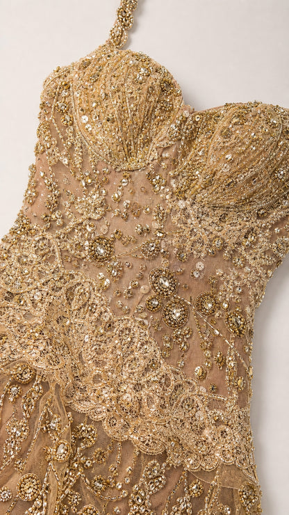 Close-up detail of gold sequin and beaded floral lace embroidery on sweetheart bodice