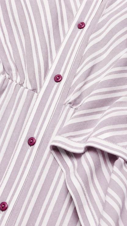 Close-up detail of lavender striped fabric, collar, and button placket