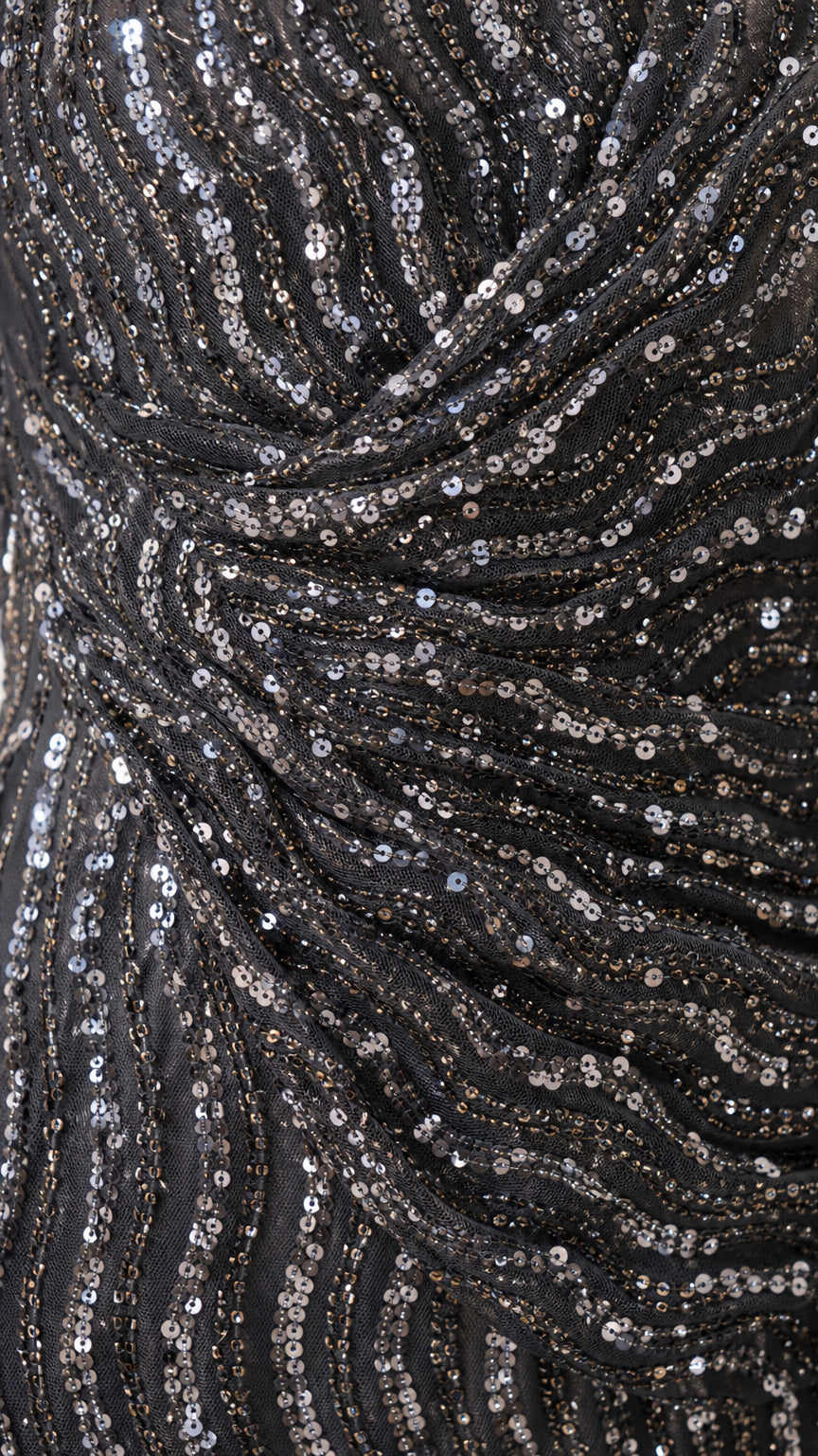 Close-up of ruched waist detail and wavy sequin pattern