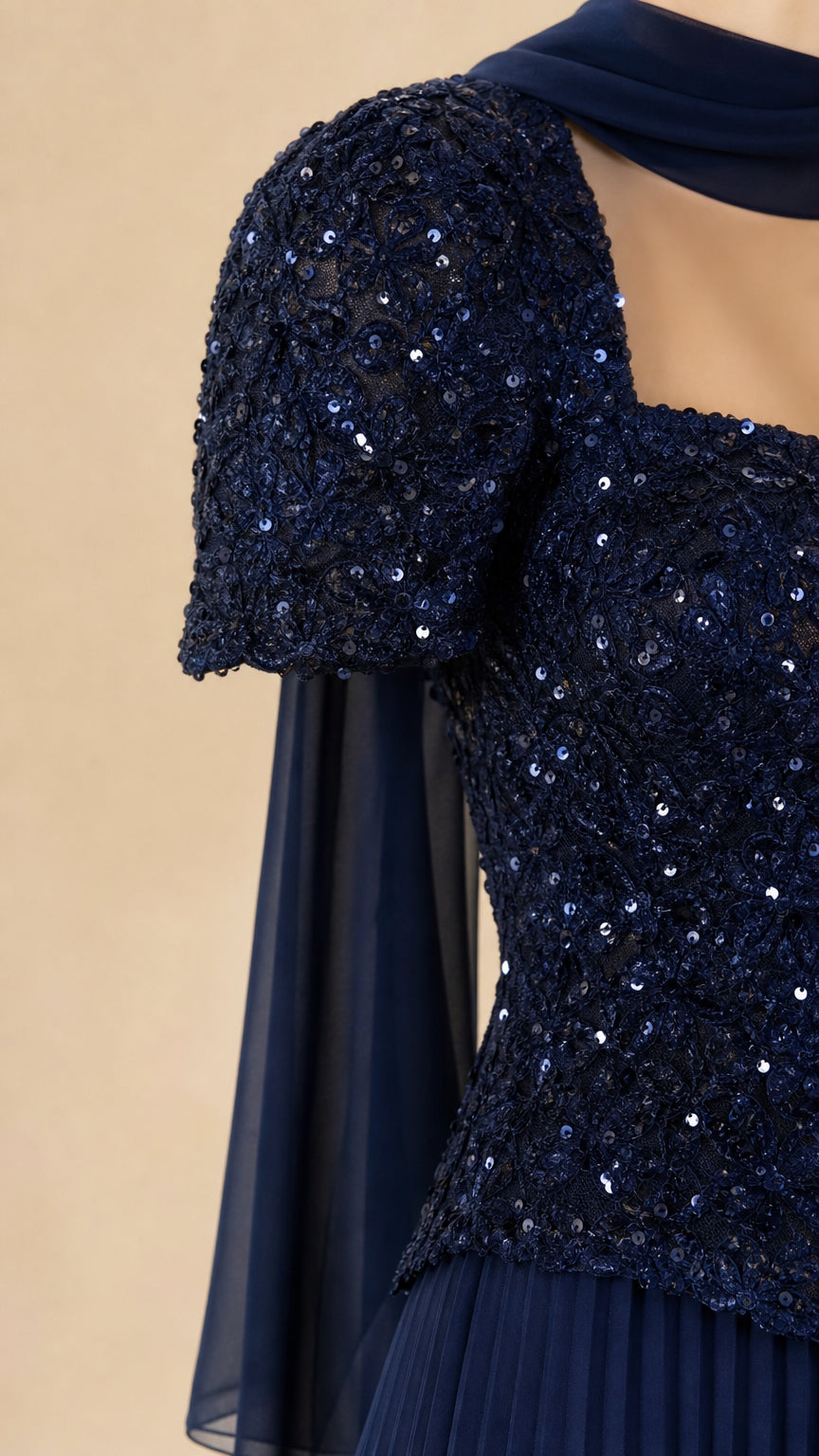 Close-up detail of Navy Blue sequined bodice, square neckline, and short sleeve