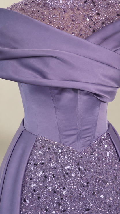 Close-up detail of lavender draped satin corset waist and shimmering sequin embellishments