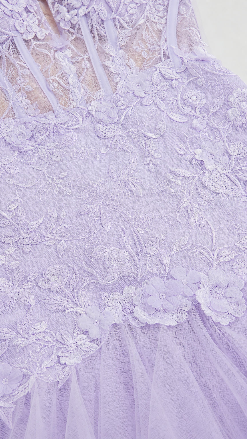 Close-up detail of sheer boned corset bodice with lavender 3D floral lace appliqués