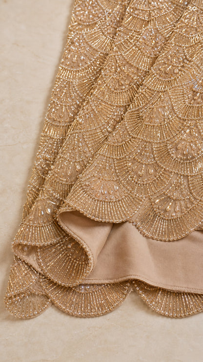 Close-up detail of intricate scalloped beading and scalloped hemline