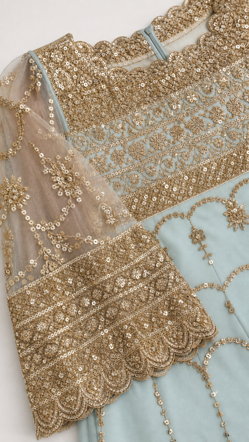 Close-up detail of intricate gold sequin embroidery and scalloped bell cuff