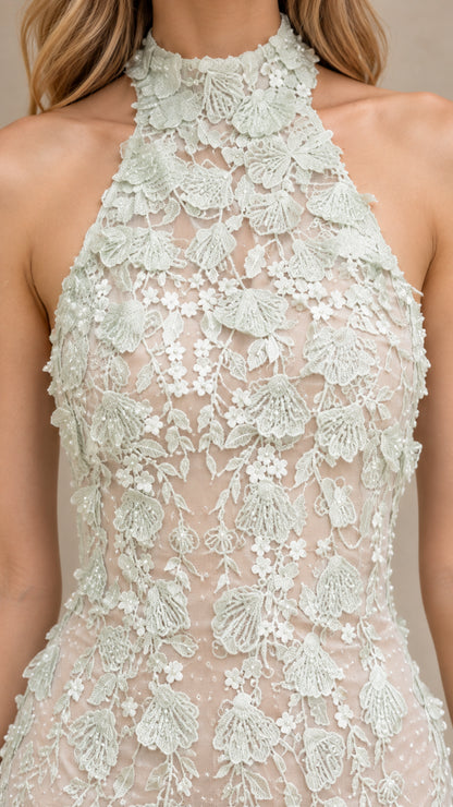 Close-up detail of 3D floral applique embroidery on halter neckline bodice