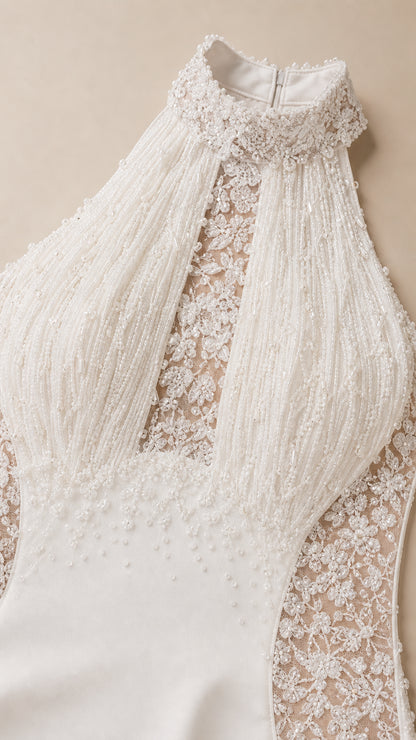 Close-up detail of high halter neckline with beaded fringe and floral lace embroidery