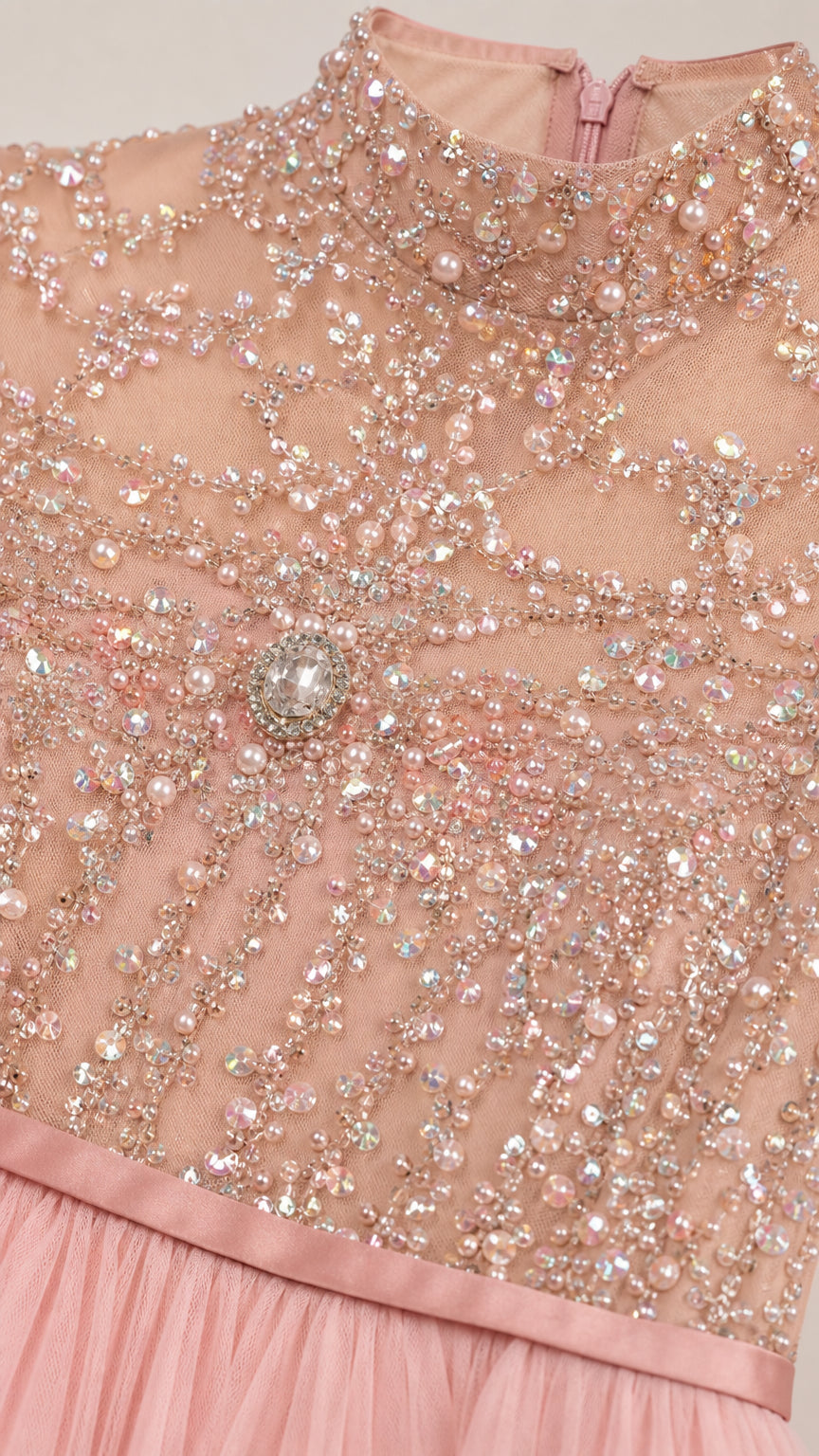 Close-up of intricate crystal and pearl beadwork on high neck bodice