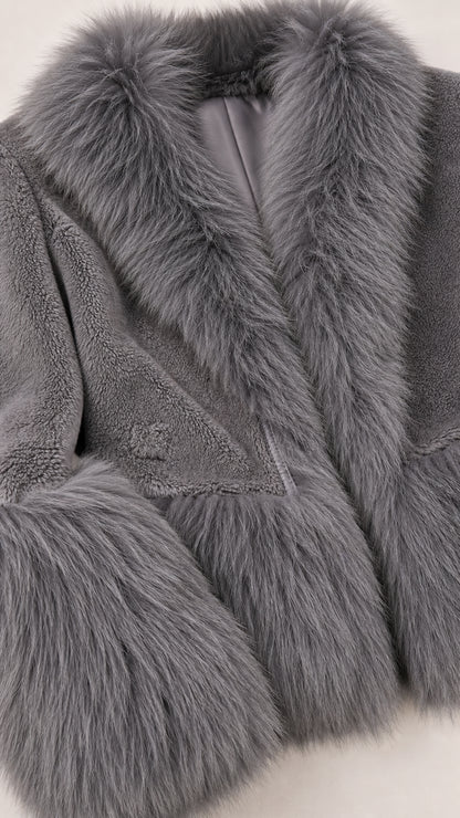 Close-up detail of grey faux fur lapel, lining, and textured plush body