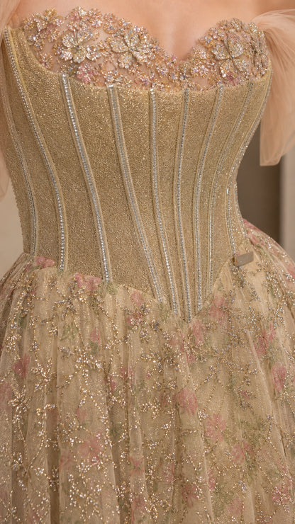 Close-up detail of champagne gold corset bodice with floral neckline embroidery and boning