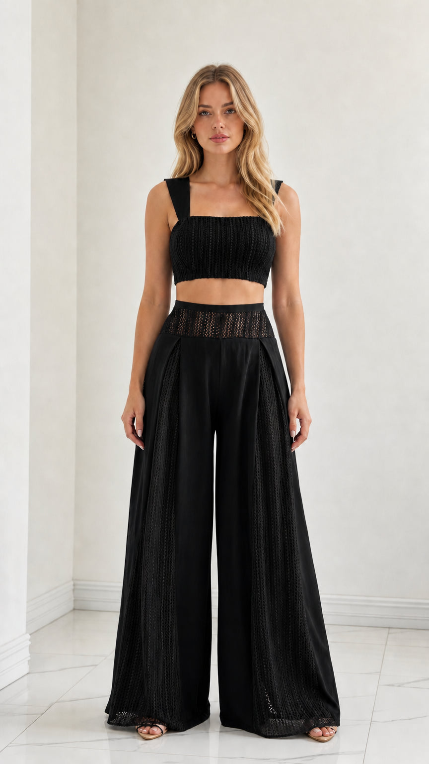 Model wearing Black two-piece crop top and wide-leg palazzo set
