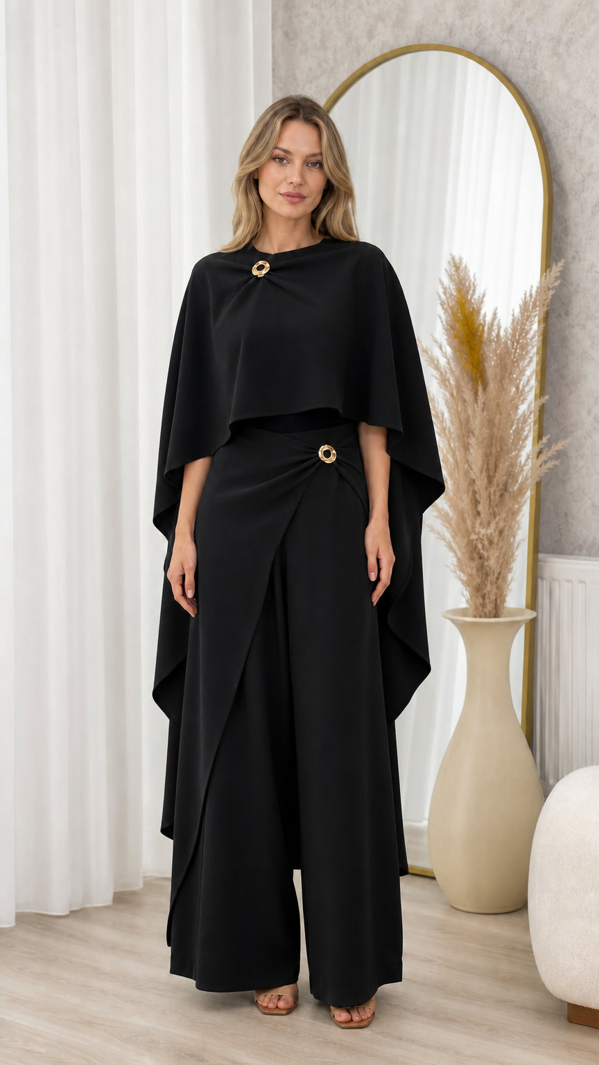 Full front view of classic black elegant cape top and wide-leg trousers set