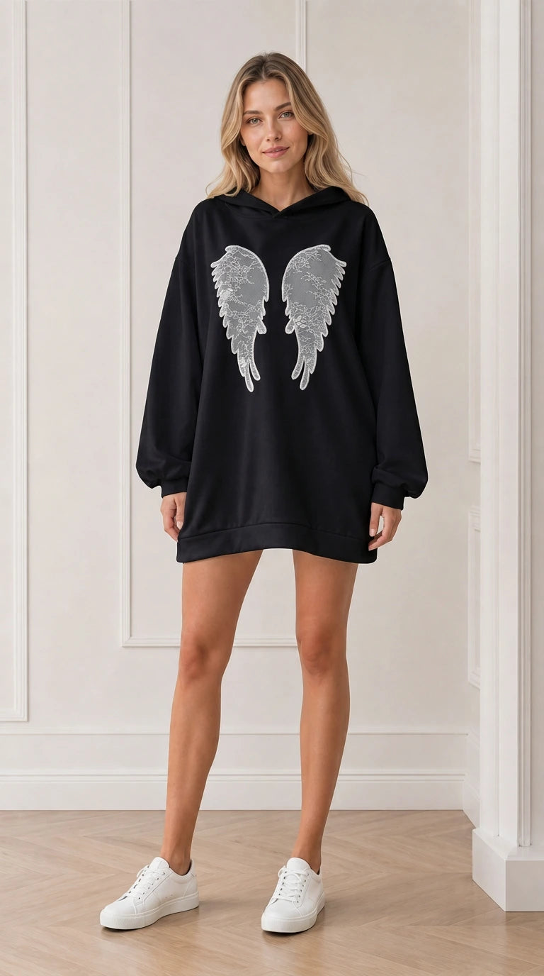 Front view of model wearing the black oversized angel wings hoodie dress