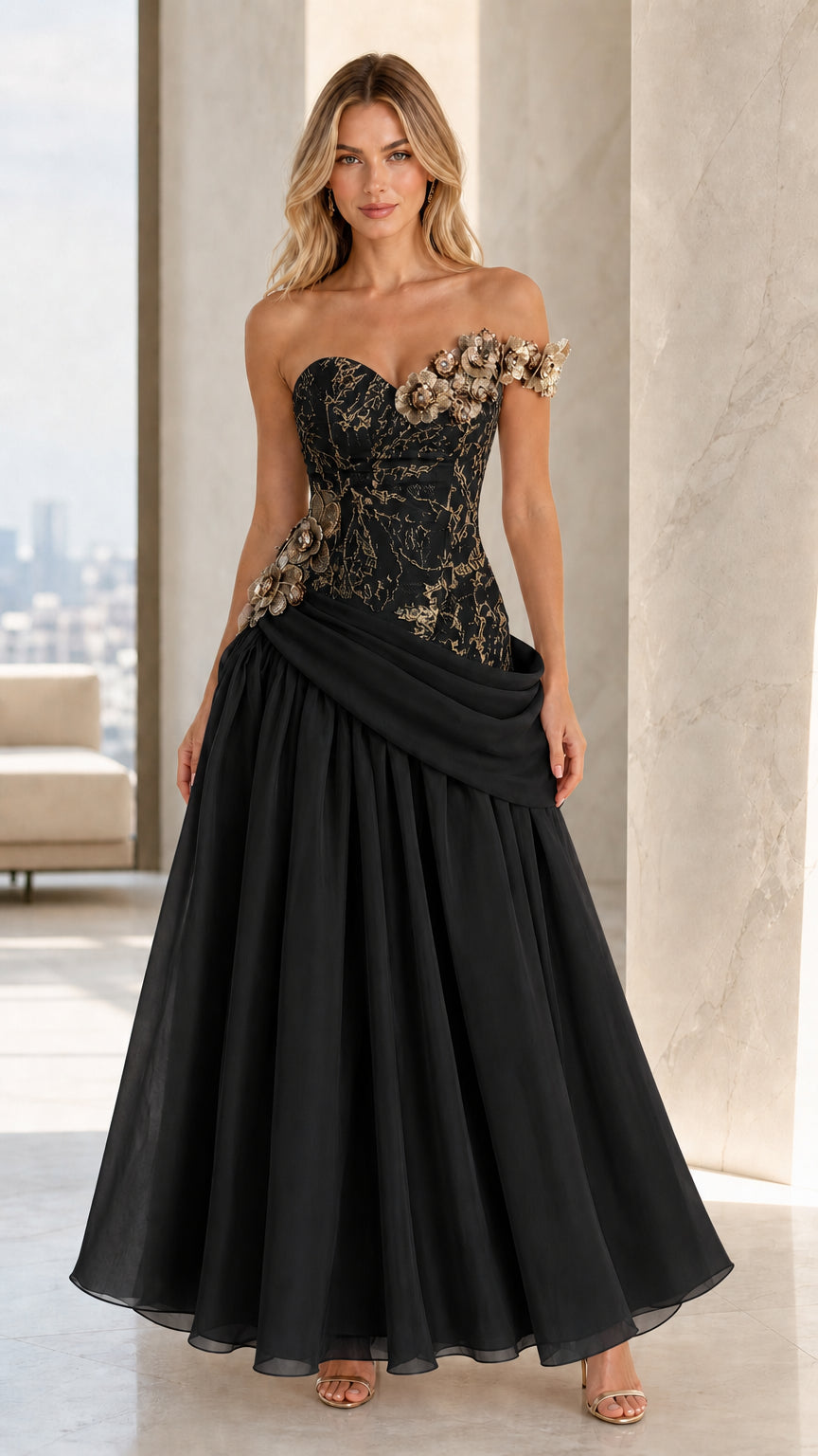 Front view of Black floral appliqué corset evening gown with pleated chiffon skirt
