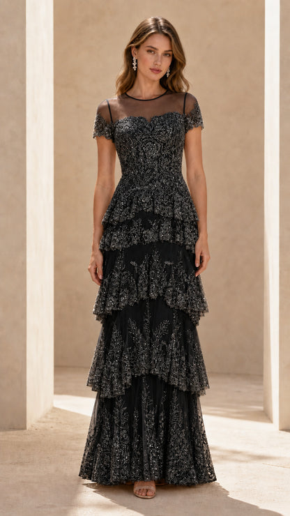 Front view of black sequined tiered formal evening gown