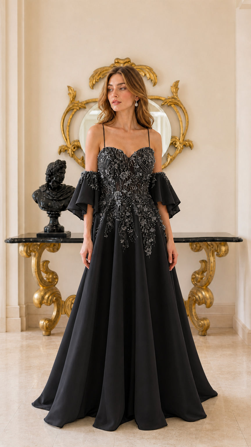 Black floral appliqué and beaded A-line evening gown with dramatic draped sleeves
