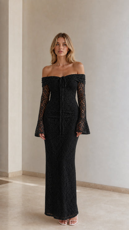 Woman wearing black off-the-shoulder floral lace maxi dress with flare sleeves