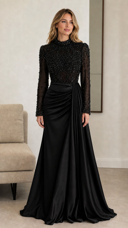 Front view of black long sleeve beaded bodice formal gown with draped satin skirt