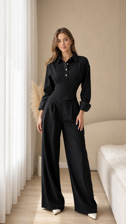 Full-length view of black corset waist shirt and matching wide-leg trousers