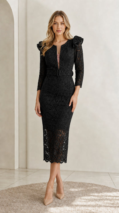 Front view of model wearing black floral lace belted midi dress with ruffle shoulders