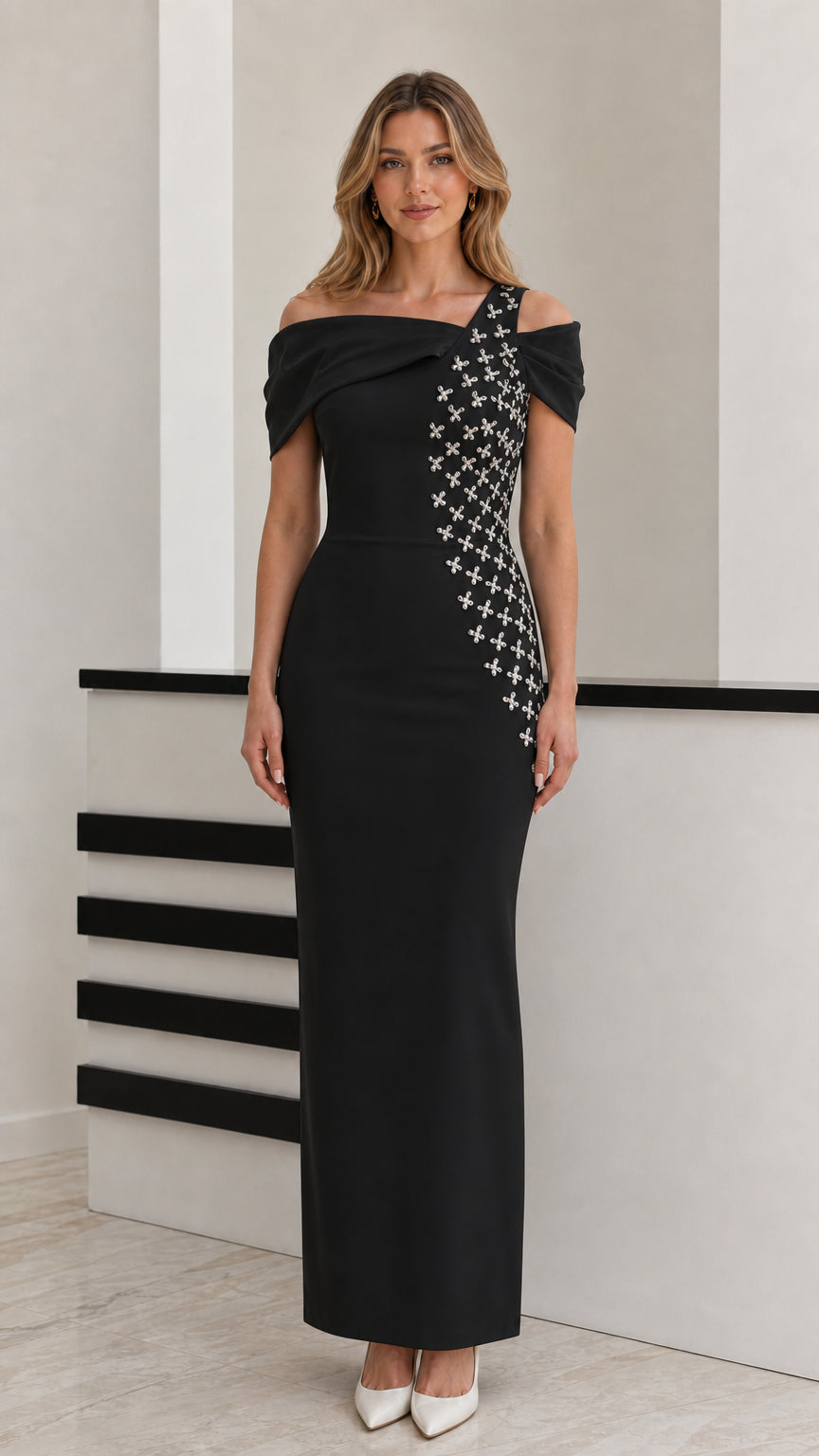 Front view of model wearing black off-shoulder rhinestone embellished maxi dress