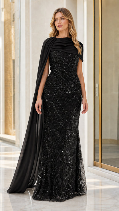 Full front view of black sequin mermaid evening gown with draped shoulder cape