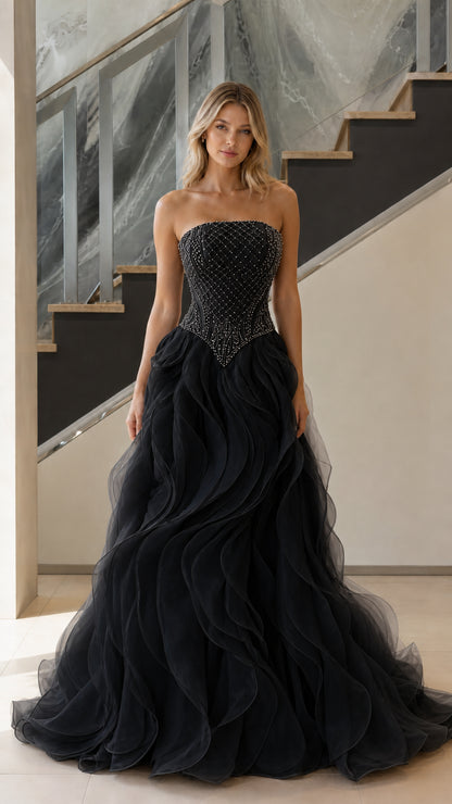 Front view of black strapless beaded basque waist ruffle ball gown