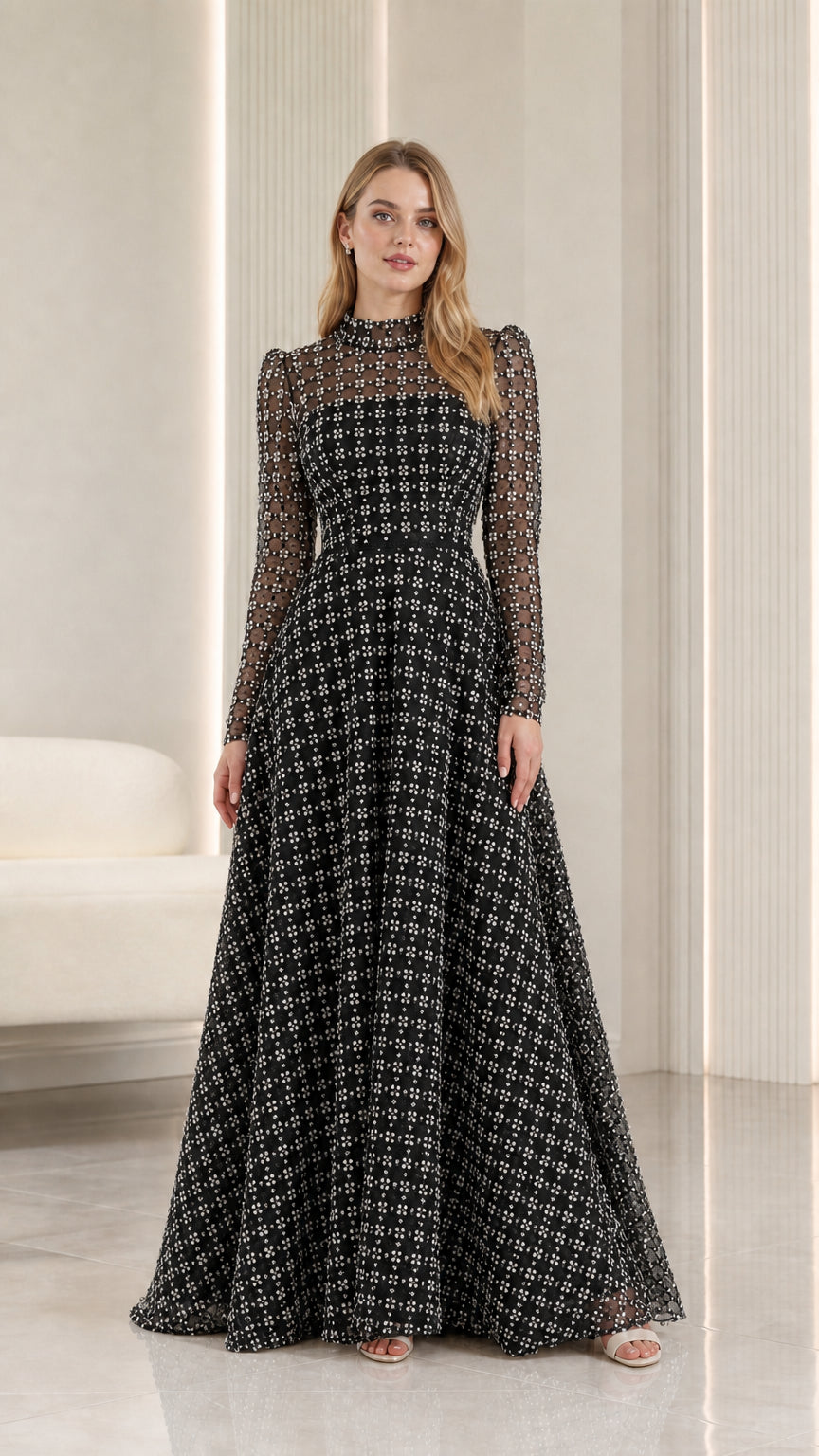 Full-length front view of black embellished illusion high-neck maxi evening gown