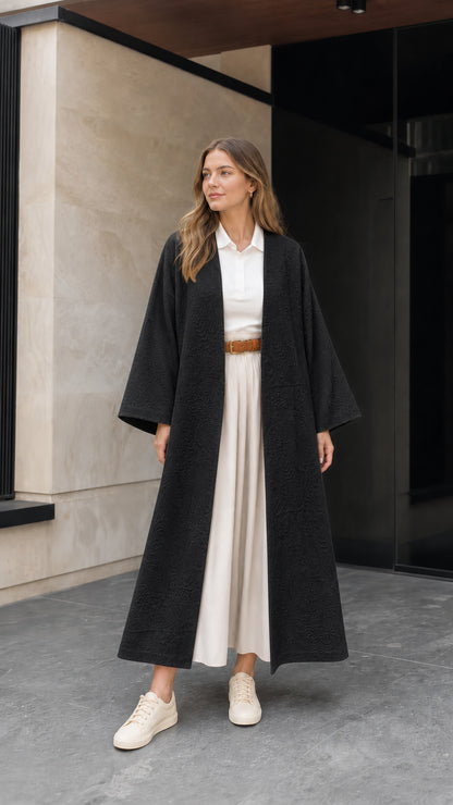 Front view of woman wearing black embossed jacquard maxi kimono duster coat
