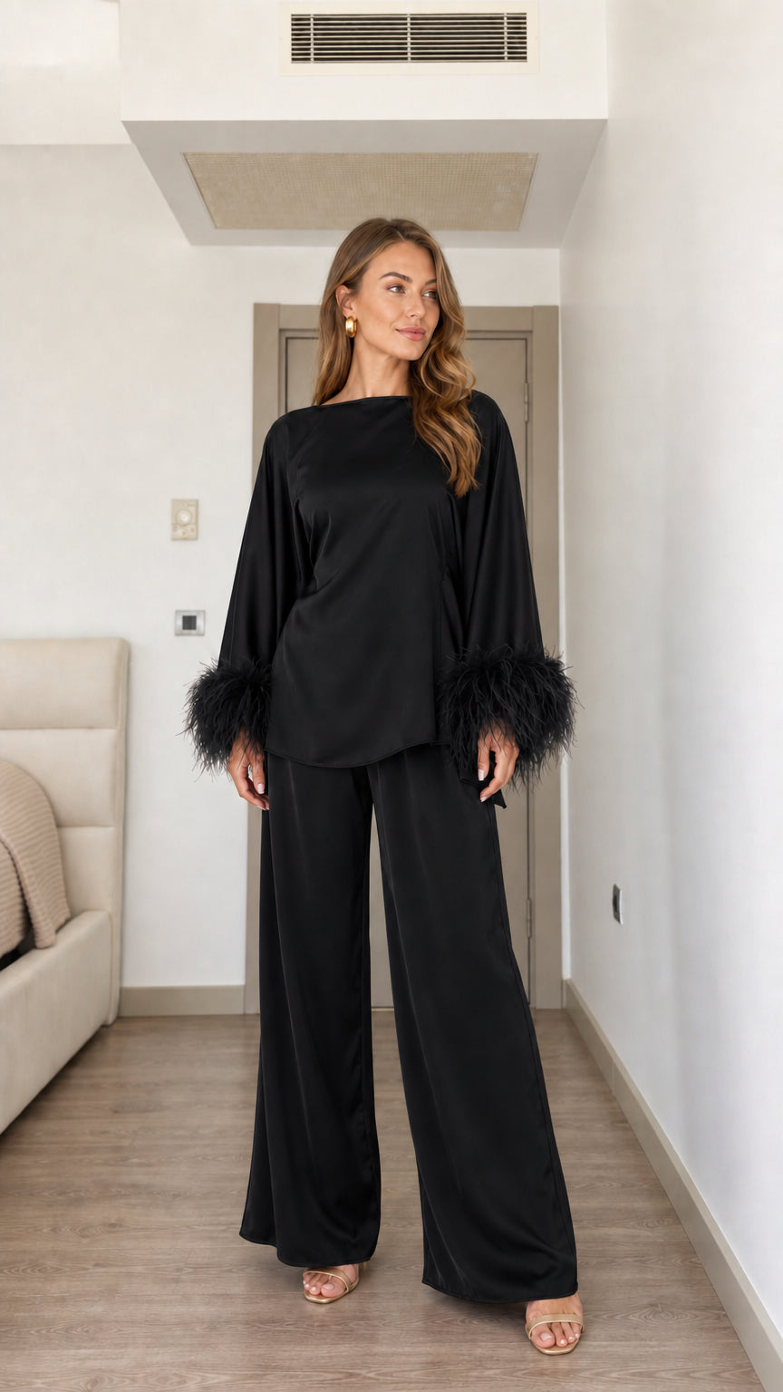Black satin two-piece set with matching feather cuff sleeves