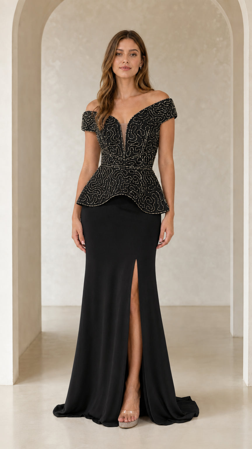 Model wearing black beaded off-the-shoulder peplum evening dress with thigh slit