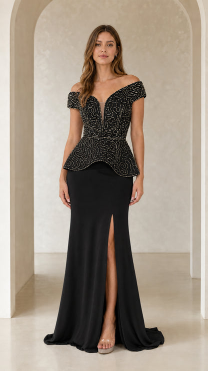 Model wearing black beaded off-the-shoulder peplum evening dress with thigh slit