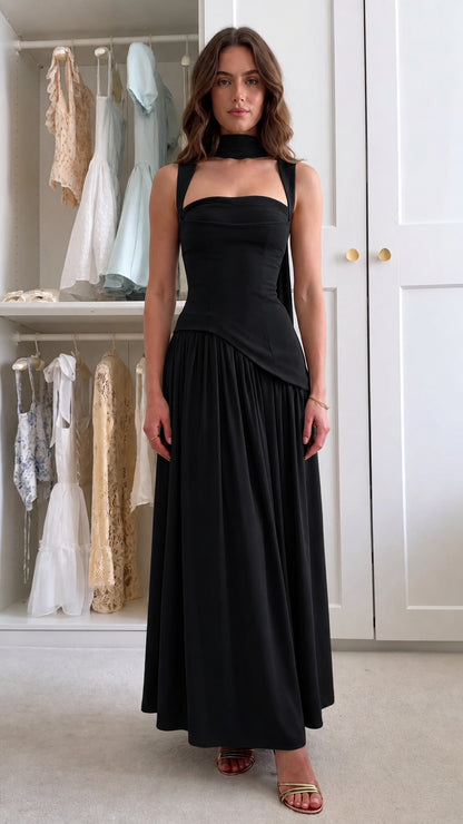 Front view of black corset drop waist maxi dress with scarf detail