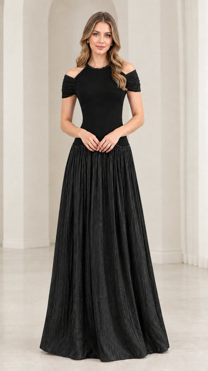 Woman wearing black cold shoulder beaded pleated maxi dress