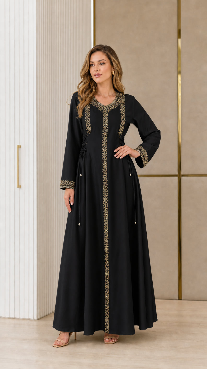 Model wearing black embroidered kaftan maxi dress with side ties