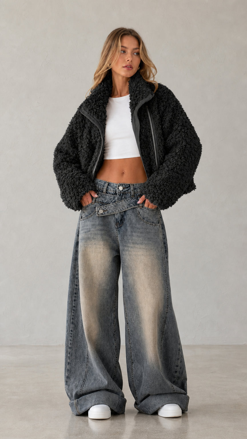 Full body studio shot of woman wearing black cropped teddy fleece jacket