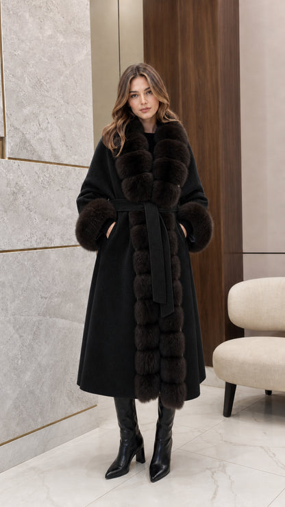 Front view of woman wearing the black longline coat with plush dark fur trim