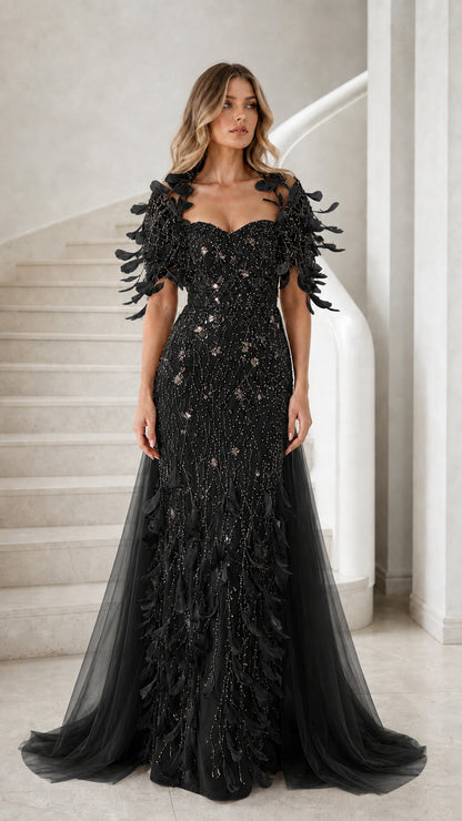 Black floor-length sequin formal gown with feather sleeves and sweeping tulle train
