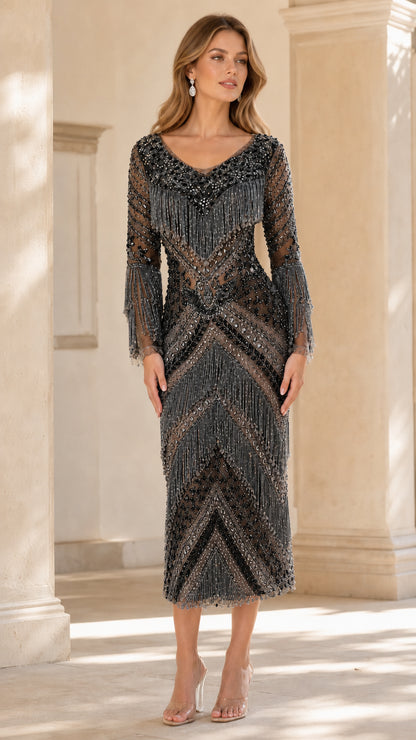 Front view of model wearing Black beaded fringe long sleeve midi dress